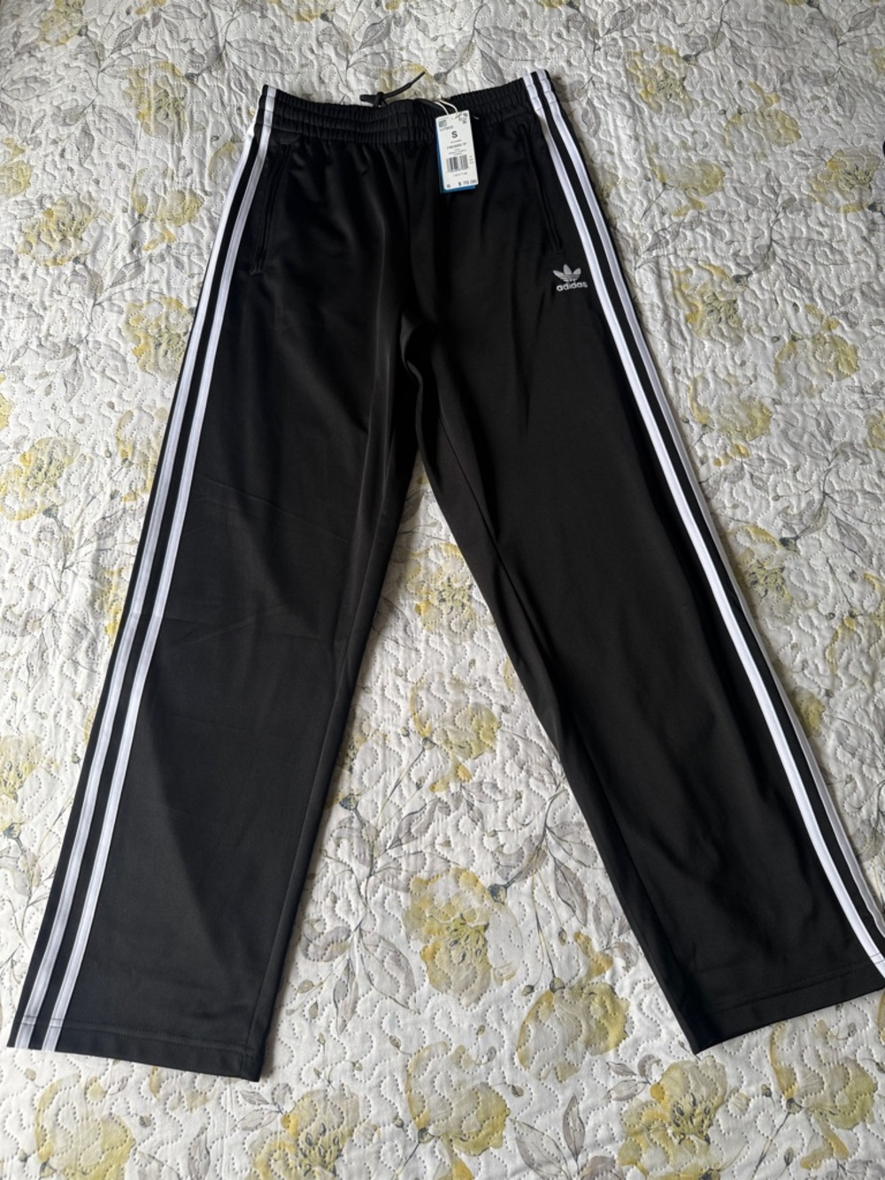 Adidas Originals pants with zippered pockets and straight leg